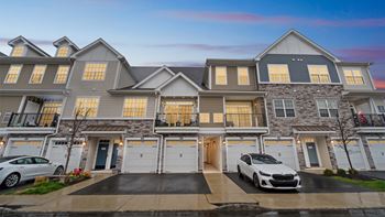 Garage apartments feature single-bay driveway and garage with direct walk-up access to unit